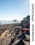 Small photo of BRIGHTON, ENGLAND, UK - 13 JUNE 2021: Tourists visit Brighton beach to relax during one of the sunniest and warmest days this summer despite the increased risk of the spread of COVID delta variant.