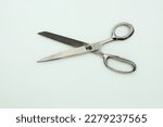 Scissors isolated white background, single used old scissors, in open position