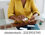 Woman sits at her table taking...