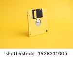 Yellow Floppy Disk On Yellow...