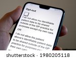 Small photo of Consent withdrawal form at NHS Digital website seen on the smartphone. Form that stops NHS patient records to be shared with third parties. Stafford, England, May 26, 2021