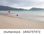 Red Yellow Warning Flag On Beach