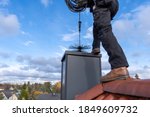 Chimney sweep cleaning a...