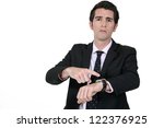 Businessman pointing at his watch
