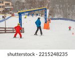 Ski slope, training slide, ski training, instructor and child student
