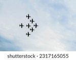 Airplanes on airshow, jets flying. Aircrafts in flying. Exciting performance. Air performance, aircrafts, flying display and skill teamwork. Abstract background