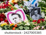 Small photo of Berlin Germany February 18, 2024: after the death of Kremlin critic Alexei Navalny, hundreds of people demonstrate in front of the Russian Embassy. Flowers, candles and letters are laid down.