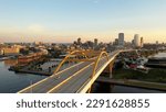 Aerial view of Hoan Memorial Bridge, highway in Milwaukee, Wisconsin, USA. Highway, traffic in morning at sunrise, Downtown in the background. Cityscape, Skyline
