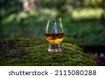 Small photo of Single malt Scotch whisky in glen cairn glass with peaty, maritime notes on forest moss in fine details