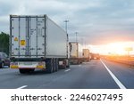 Small photo of Lorry trucks cars in traffic jam at border zone custom, sunset time