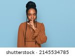Young african american woman wearing casual clothes asking to be quiet with finger on lips. silence and secret concept. 