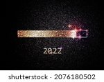 Small photo of Modern 2022 New Year graphic design template with golden loading bar and glimmering particles on black background