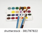 four brush and paint on a white ... | Shutterstock . vector #381787822