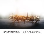 the crown of thorns of Jesus on  black background against  window light with copy space, can be used for Christian background, Easter concept