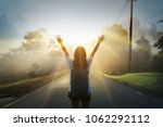 Small photo of Happy young Girl Enjoy Backpacking.Watch the first light of the morning sun on the mountain.Feel refreshed and energize your life.
