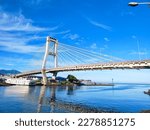 Manado, Indonesia – March 19, 2023: Soekarno bridge is one of icon at the Manado City, North Sulawesi. This brigde have leght about 1127 meter.  The view of Soekarno bridge with beautiful