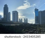 Small photo of LRT skyline Dukuh Atas Stasion, Indonesia - January 20, 2024: The view of the city of Jakarta in Dukuh Atas is visible from the LRT Skyline