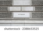 Small photo of London, UK - March 15, 2023: HM Treasury marked on the wall of a government building in Westminster, London, England.