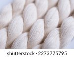 Close up of natural cotton rope. Thick cotton rope showing detail of threads and fibres, macro shot