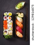 Bento Box With Sushi And Rolls