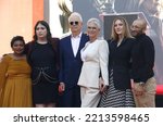Small photo of Kynthia Guest and wife Ruby Guest, Christopher Guest, Jamie Lee Curtis, daughter Annie Guest and husband Jason Wolf at Jamie Lee Curtis hand and footprint in cement ceremony in Hollywood Oct. 12, 2022