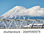 Small photo of Japan - January 31, 2019 : High Speed Bullet Train Shinkansen run on the iron bridge across Fuji river with Fuji mountain background in Winter, Fuji, Shizuoka