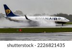 Small photo of Manchester Airport, United Kingdom - 21 October, 2022: Ryanair Boeing 737 (EI-EVN) on reverse thrust.