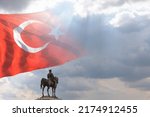 Small photo of Monument of Mustafa Kemal Ataturk and Turkish flag. Turkish public days background photo. 29th october republic day or 29 ekim cumhuriyet bayrami concept photo with copy space.