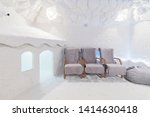 Salt Cave Interior With Chairs For Patients And Children's Playhouse on foreground. Room For Halotherapy Sessions With Textured Walls.