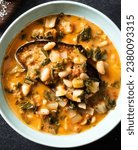 Small photo of Acquacotta, a traditional Italian dish, features cannellini beans, fennel, and escarole in a broth thickened with egg yolks. The Instant Pot cooks brined dried cannellini beans to a soft texture