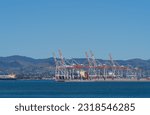 Small photo of Tauranga New Zealand - June 6 2023; Tauranga Harbour with port container cranes in background