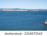 Small photo of Tauranga New Zealand - June 6 2023; Tauranga Harbour with port container cranes in background