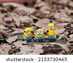 Small photo of Minions characters from despicable me movie. Toys photography concept. Unfocus and blurred view.