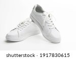 Pair of New White Sneakers Over White Background. Horizontal Image