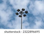 Above view of High-mast lighting, city square or highway lighting pole with blue sky 