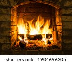 Burning firewood in fire box of ...