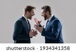 Small photo of dissatisfied men discuss failure. two colleagues have disagreement and conflict. businessmen face to face. disrespect and contradiction. business partners blame each other. arguing businesspeople.