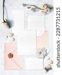 Small photo of Flay lay wedding invitation setup mock-up in pink color theme