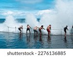 Small photo of NEWCASTLE, NEW SOUTH WALES, AUSTRALIA - January 20, 2022. People are playing at Bogey Hole in Newcastle, and it's one of the oldest ocean baths in Australia.