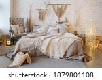 Small photo of Front view of cozy bedroom with soft plaid and warmth blanket on comfortable bed, pillows, cushions, armchair, home decor and interior design in bohemian style