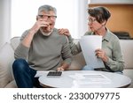 Small photo of Stressed retired wife and husband manage family finances. Feeling desperate due debts, unpaid bills, lack of money to pay monthly loan or bank mortgage. Financial crisis, bankruptcy concept