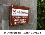 No drone zone sign not allowing flying of quad copter around tall building
