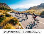 Team sport cyclist photo. Group of triathlete on bicycle ride on the road at Mallorca, Majorca, Spain.