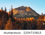 The Gerlach peak stands tall and proud in the High Tatras, surrounded by the vibrant colors of autumn