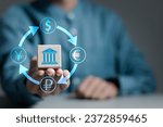 Small photo of Foreign currency exchange digital concept. Businessman holds wooden cube with currency symbols of dollar, euro, ruble and yen. International money transfer or payments via online banking by fintech.