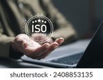 Small photo of ISO standards quality control. Businessman use laptop with quality assurance with five stars or guarantee product. ISO Standard certification. Modern ISO banner.