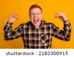 Small photo of Photo of young guy stressed show hands blah blah symbol irritated isolated over yellow color background.