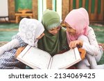 Group of a children reading a...