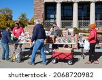 Small photo of Boulder, CO USA - October 28, 2021: Mobile food pantry food giveaway at the University of Colorado Boulder campus. People line up for free groceries outside the UMC