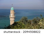 Stone And Blue Minaret Of A...